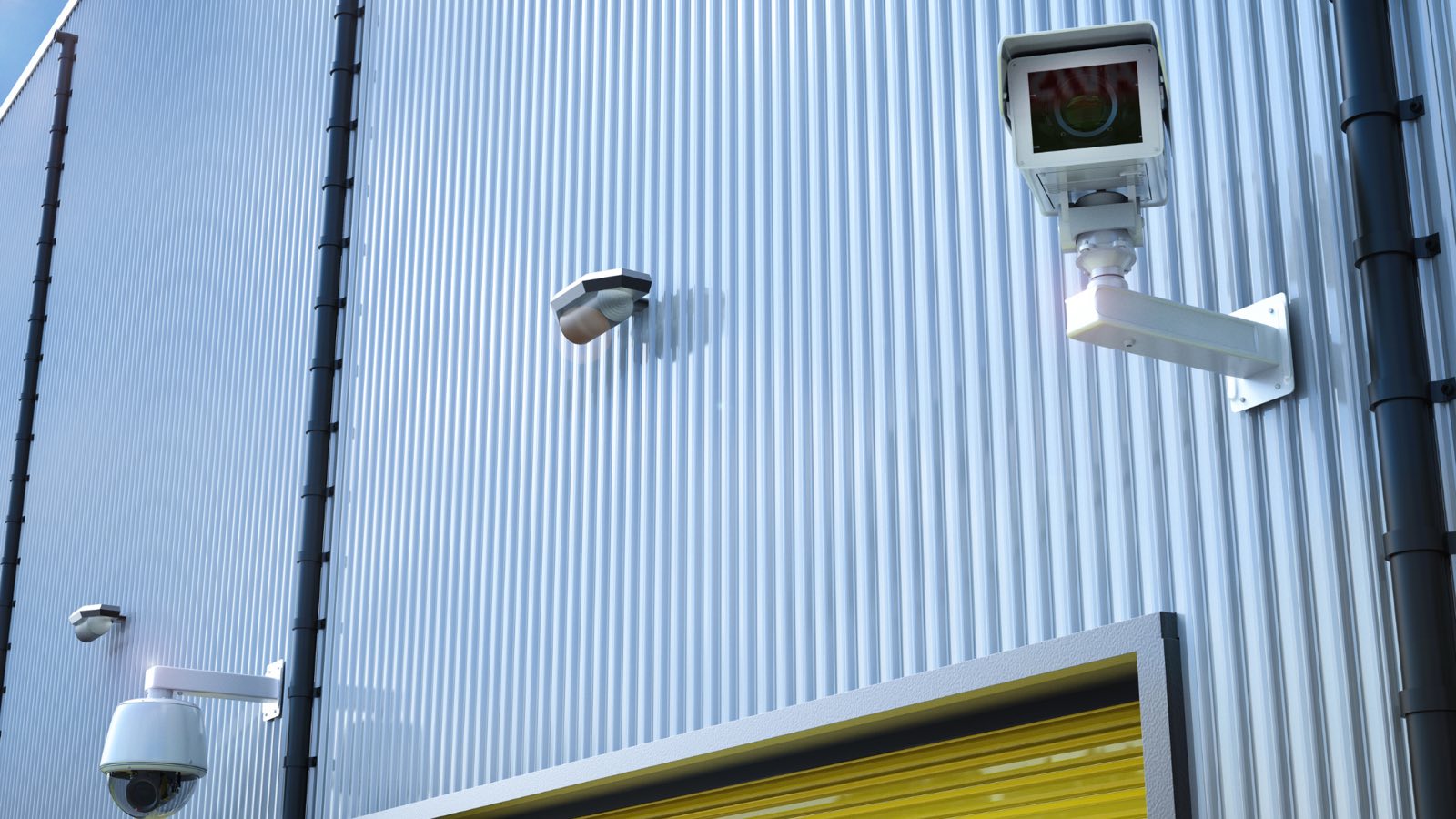 Exterior security cameras covering a warehouse loading bay